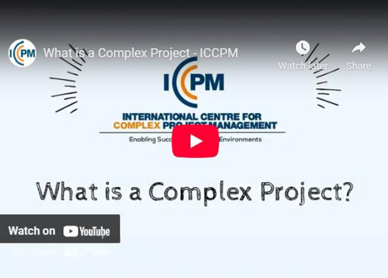 A video button over a screen with words, ‘What is a complex project?’