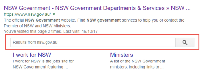 Screenshot of a Google search result for the NSW Government website featuring a site search box directly within the search listing. The result includes links to NSW Government services and sections such as “I work for NSW” and “Ministers”. The image demonstrates a search-enhanced result that allows users to search content within a website directly from the search results page.