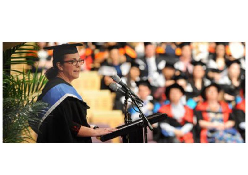 Helen Dogan giving a speech at her QUT PSMP graduation ceremony