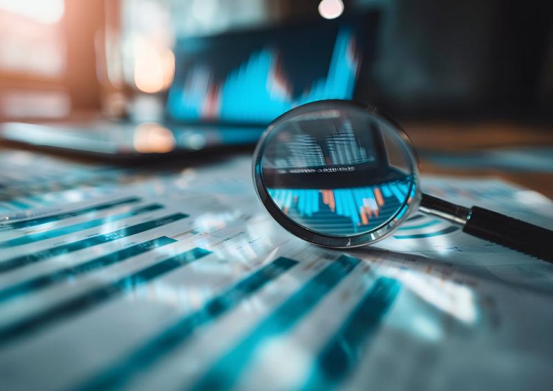An AI image of an out of focus computer keyboard with a magnifying glass point of view looking to the desktop screen