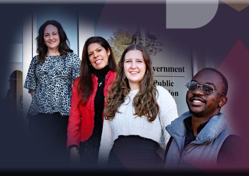 APSC colleagues posing and smiling in front of office building