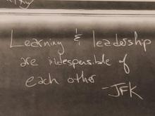 Image of blackboard with quote, “Learning and Leadership are indispensable of each other”.