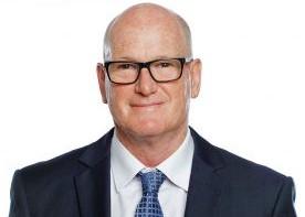 Portrait of David Walton wearing a suit and tie.