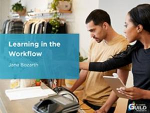 Illustrative photo image of a woman and a man in a retail clothes shop with the woman giving instructions to the man on how to undertake a task.