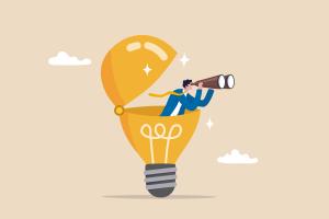 An illustrative lightbulb with a graphic of a man holding binoculars to his eyes standing inside the top of the lightbulb. 
