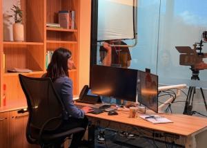 Photo of video subject taken from inside the filming studio 