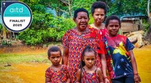 Pacific women and children smiling for photo with finalist overlay