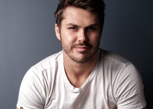 An image of Ethan Taylor looking into camera