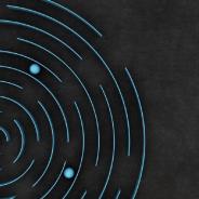 Black box with circular maze and blue balls.