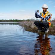 Illustrative image of person who is measuring water quality.