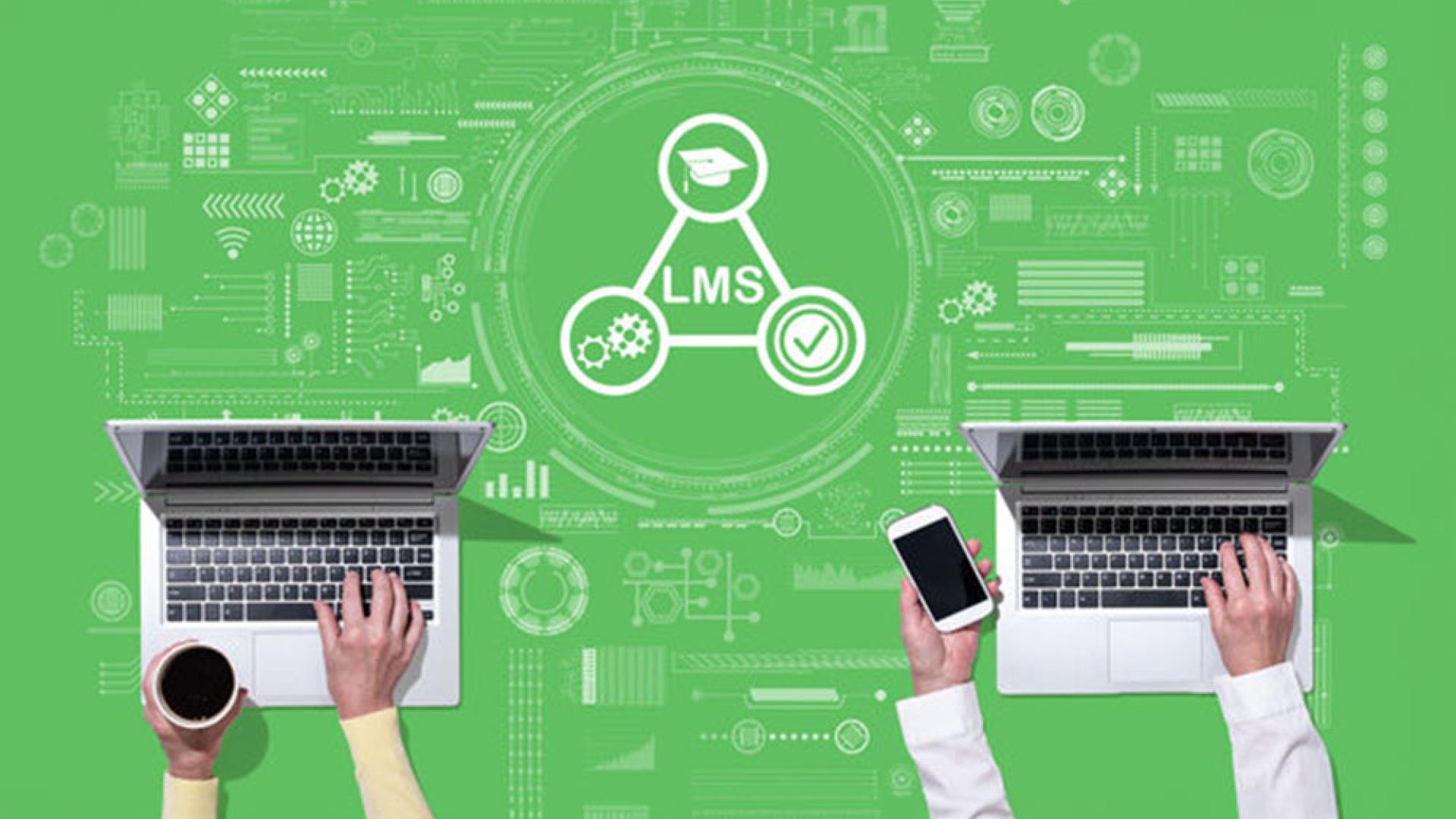 An illustrative image of two computers with two people’s hands at them with a graphical representation of a triangle featuring the acronym LMS (which stands for Learning Management System). 