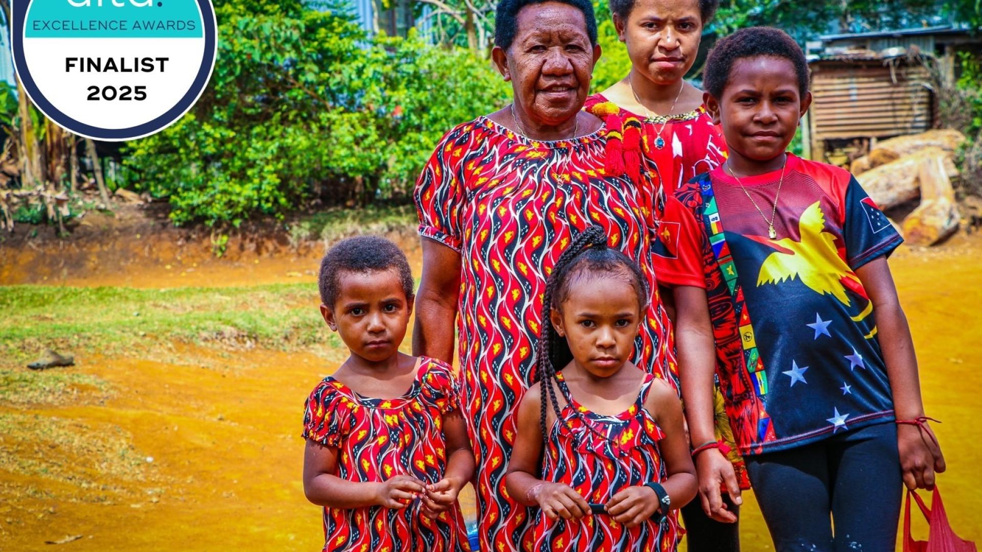 PNG family photo with AITD excellence awards logo in corner.