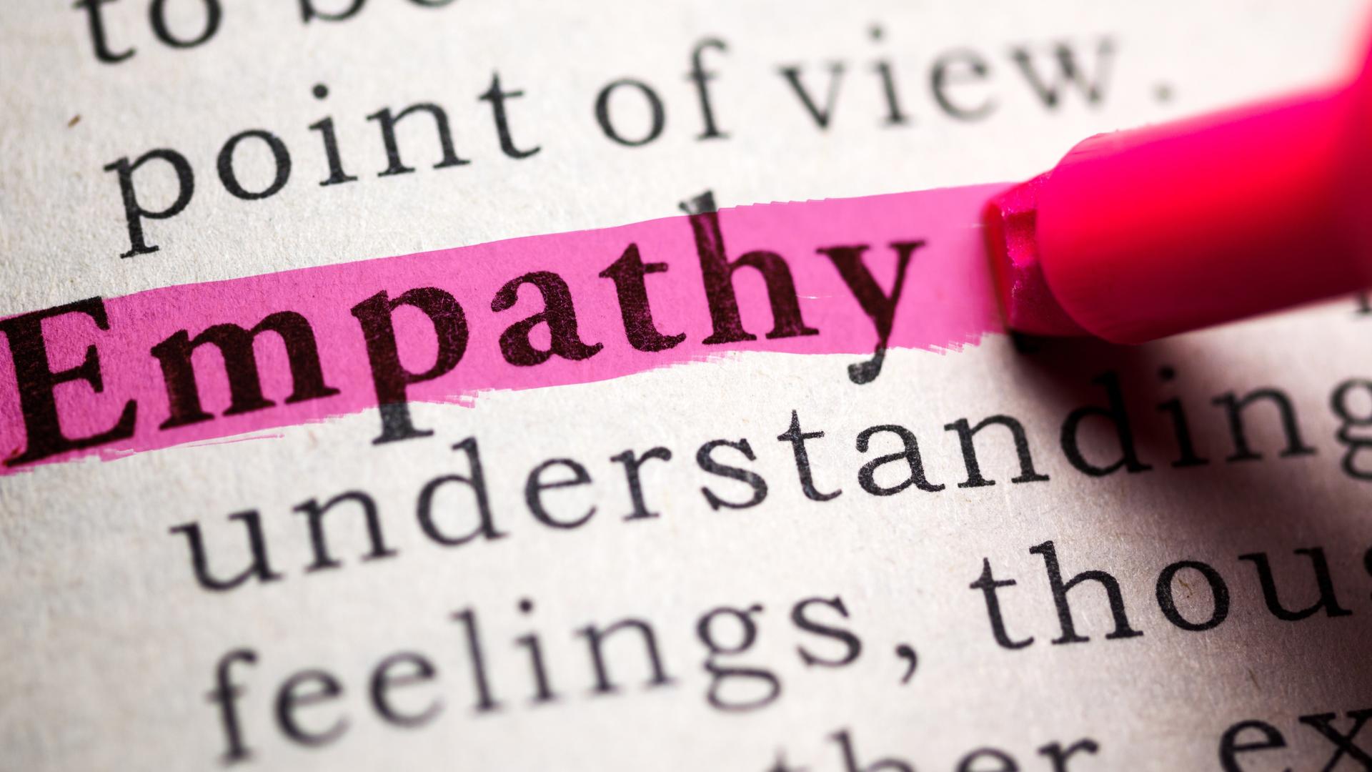An illustrative picture of a pink highlighter pen being used on the word ‘empathy’ in a sentence of text.