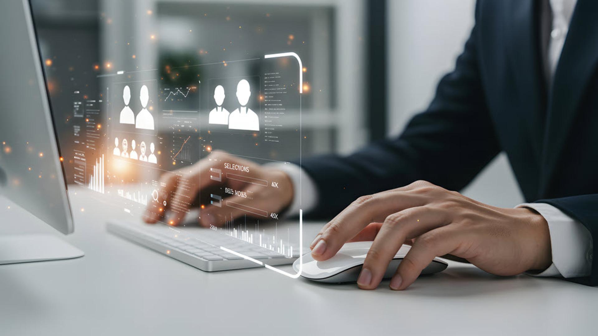 Business Professional Using Computer with Futuristic Interface for Data Analysis and Recruitment