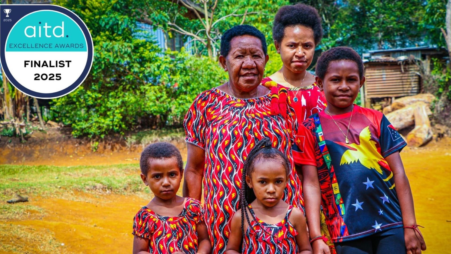 Pacific women and children smiling for photo with finalist overlay