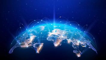 Blue background with an image of a representation of earth. The borders of the countries are lit up in lights.