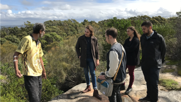 5 people on a rock having First Nations understanding shared